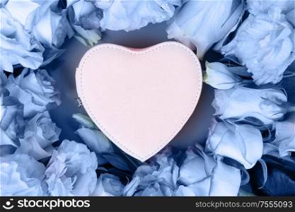 Rose fresh flowers bouquet on table from above, flat lay scene in classic blue color. fresh rose flowers on gray
