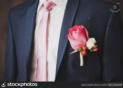 Rose in a pocket on a breast 2087.. Rose flower in a breast pocket.
