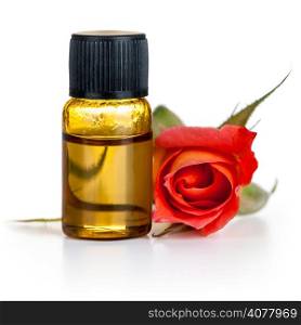 Rose oil in bottle with red rose flower on white background