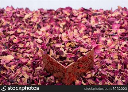 Rose petals in box and as a background. Dried rose petals in box and as a background