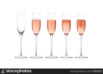 Rose pink champagne glass with bubbles isolated on white background