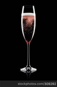 Rose pink champagne glass with bubbles on black background with reflection