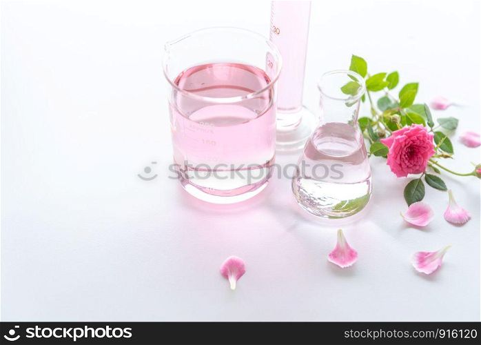 Rose spa treatments on white wooden table. Healthcare and body therapy massage relaxation concept. Beauty and Healthy theme. Pure natural extract and Medical theme.