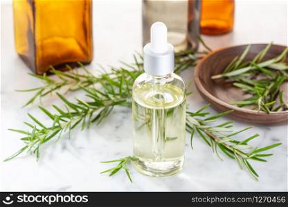 Rosemary essential oil. Rosemary oil for skin care, spa, wellness, massage, aromatherapy and natural medicine