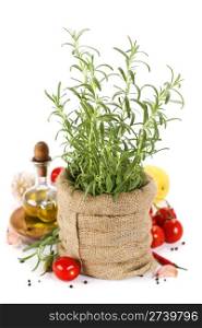 Rosemary in a burlap bag and fresh vegetables