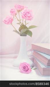Roses and old book. Toned image