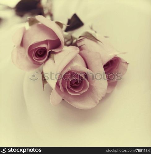 Roses bouquet on silk. Vintage style.