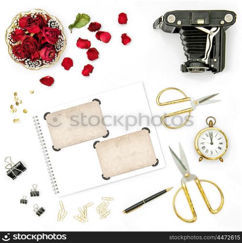 Roses flowers, vintage camera and photo frames. Flat lay holidays background