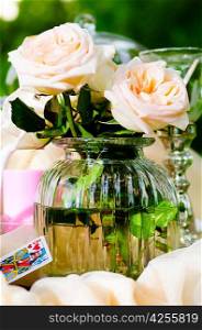 roses in jar on table