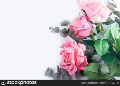 Roses with leaves. Pink Roses with leaves, flat lay flower composition on white background