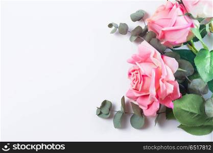 Roses with leaves. Roses with leaves, flat lay flower composition on white background
