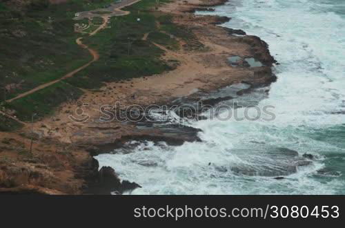 Rosh Hanikra landscape with waves of Mediterranean Sea washing rocky coast