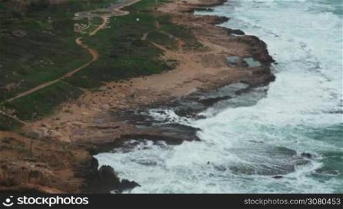 Rosh Hanikra landscape with waves of Mediterranean Sea washing rocky coast