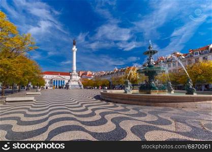 Rossio square with wavy pattern, Lisbon, Portugal. Rossio square with wavy cobble stone pattern, fountain and monument of Pedro IV in Lisbon, capital of Portugal