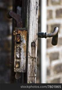Rostschloss. rusty lock and a door handle of an old building
