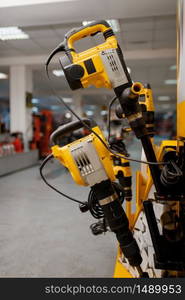 Rotary and demolition hammers in power tool store closeup, nobody. Choice of equipment in hardware shop, electrical instrument in supermarket. Rotary and demolition hammers in power tool store