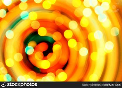 Rotary motion bokeh background of bright orange lights. Motion bokeh background