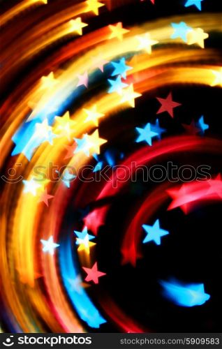 Rotary motion bokeh stars background of bright lights. Motion stars background