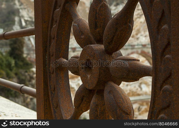 Rotary rail. Close-up of a particular of parapet an road of marble.