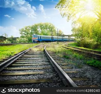 Rotate the railway with train under sunny skies