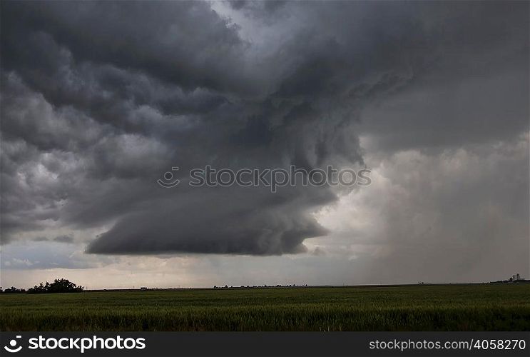 Rotating supercell clouds over field