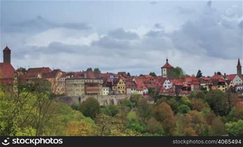 Rothenburg on Tauber cityscape above the forest, cloudy timelapse