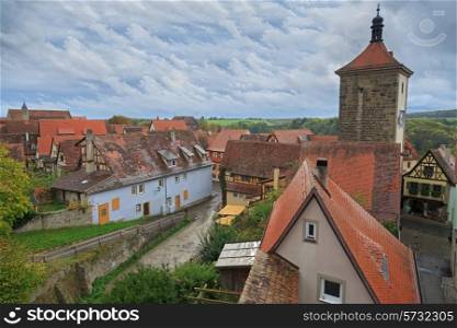 Rothenburg on Tauber cityscape with house roofs, cloudy top view&#xA;