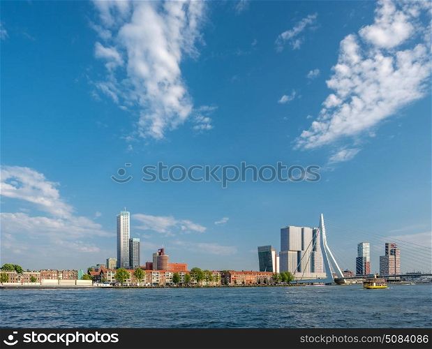 Rotterdam city cityscape skyline with Erasmus bridge and Nieuwe Maas (Rhine) river in front. South Holland, Netherlands.