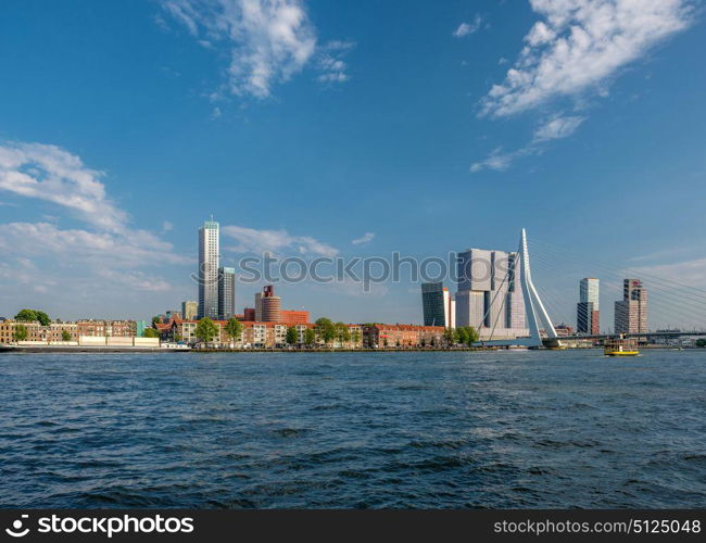 Rotterdam city cityscape skyline with Erasmus bridge and Nieuwe Maas (Rhine) river in front. South Holland, Netherlands.