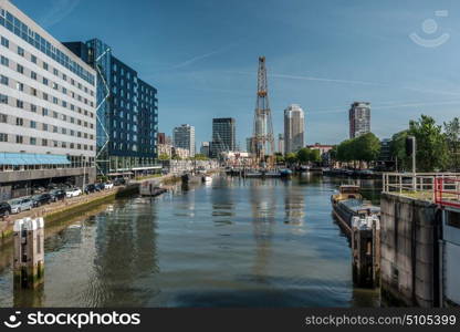 Rotterdam city cityscape skyline with water canal in front. South Holland, Netherlands.