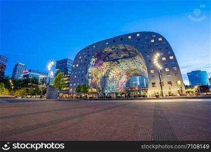 Rotterdam, Netherlands - May 13, 2019: Night view of Rotterdam skyline at night with Markthal the new market in Netherlands.