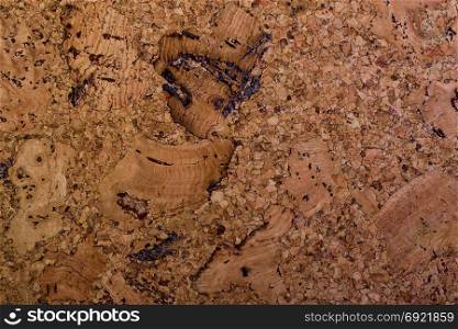 rough brown wallpaper of pieces of natural cork tree