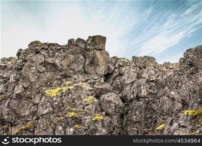 Rough cliffs with green moss in Iceland