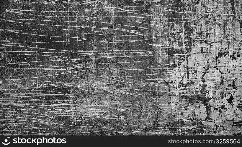 Rough scratched and textured cement wall.