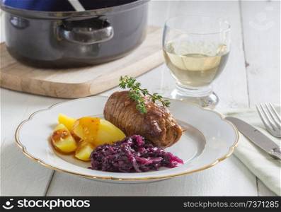 Roulade of beef with potatoes and red cabbage.. Roulade of beef with potatoes and red cabbage