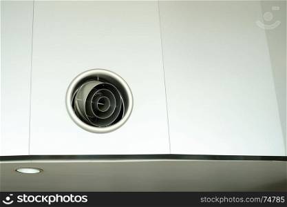 round air grille diffuser on the wall