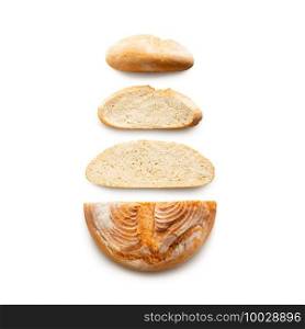 Round baked grain bread sliced isolated on white background. Top view. Round baked grain bread