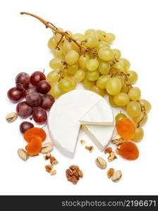 Round brie or camambert cheese and grapes isolated on a white background. Round brie or camambert cheese and grapes on a white background
