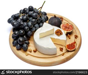 Round brie or camambert cheese on cutting board isolated white background. Round brie or camambert cheese on cutting board white background