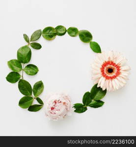 round frame made peony gerbera flowers with green leaves