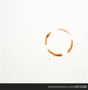 round imprint of a coffee cup on a white paper background, close up