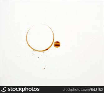 round imprint of a coffee cup on a white paper background, close up