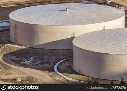 round metal water tanks at filtration plant - industrial architecture abstract