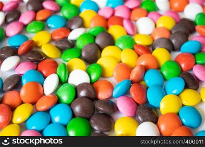 Round, multi-colored, chocolates. Close-up. A pile of multicolored candies. Round, multi-colored, chocolates. A pile of multicolored candies