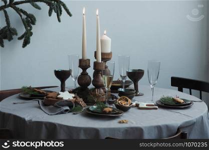 Round served table with festive vintage table setting.