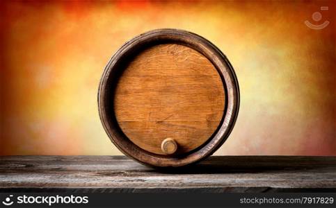 Round wooden barrel on a colored background