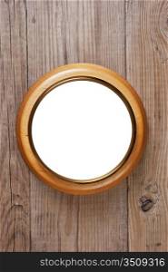 round wooden frame on a wooden wall
