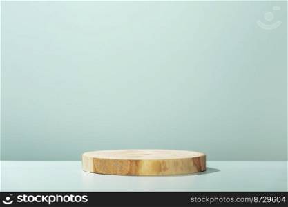 Round wooden saw cut cylinder shape on blue background abstract background. Minimal box and geometric podium. Scene with geometrical forms. Empty showcase for eco cosmetic product presentation