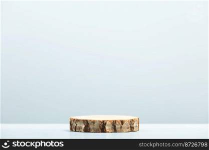 Round wooden saw cut cylinder shape on blue background. Minimal box and geometric podium. Empty showcase for eco cosmetic product presentation. 3D Render. 
