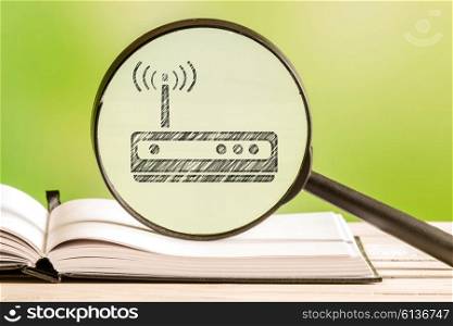 Router setup with a pencil drawing of a router icon in a magnifying glass